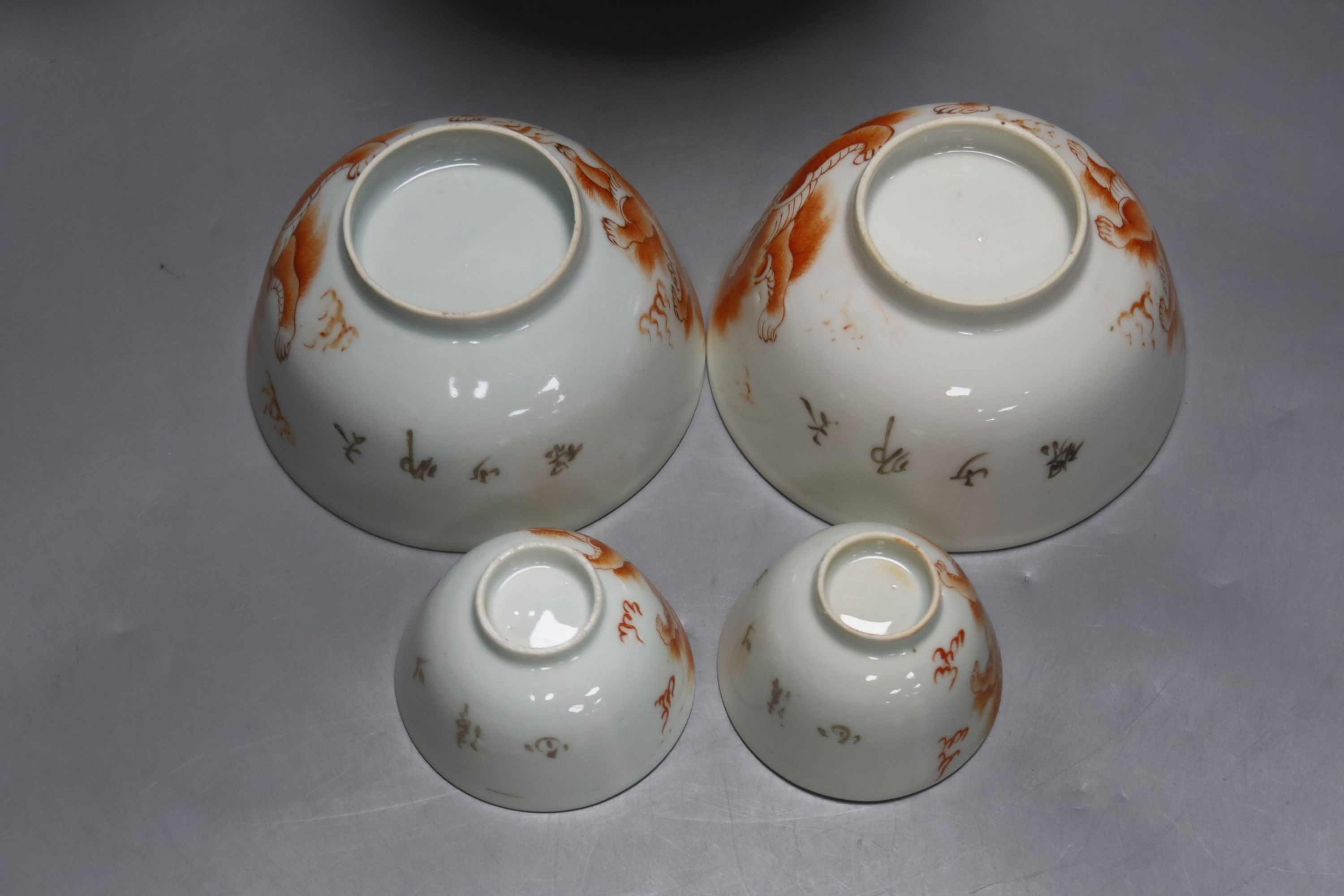 A group of 19th century Chinese porcelain table ware, painted in iron red, teapot 14cm